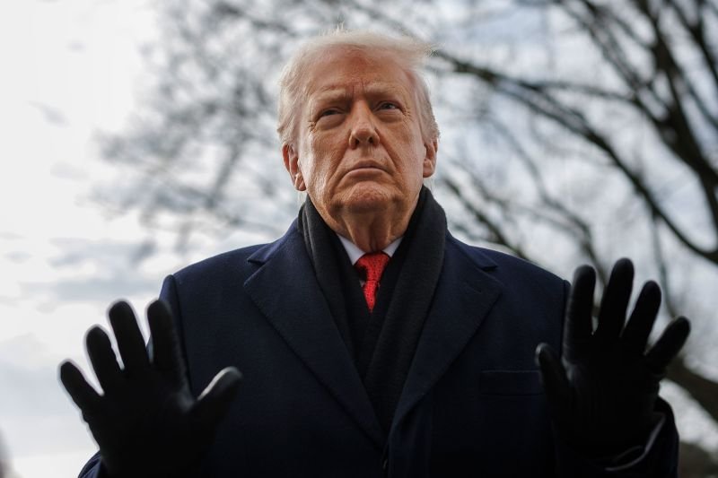 President Donald Trump speaks to reporters on the South Lawn before boarding Marine One at the White House on January 16, 2026.