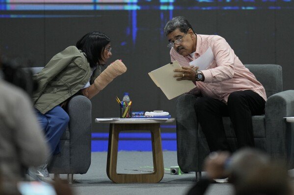 Venezuelan President Nicolas Maduro, right, talks with Vice President Delcy Rodriguez during a meeting with international observers in Caracas, Venezuela, July 27, 2024. (AP Photo/Matias Delacroix, File)