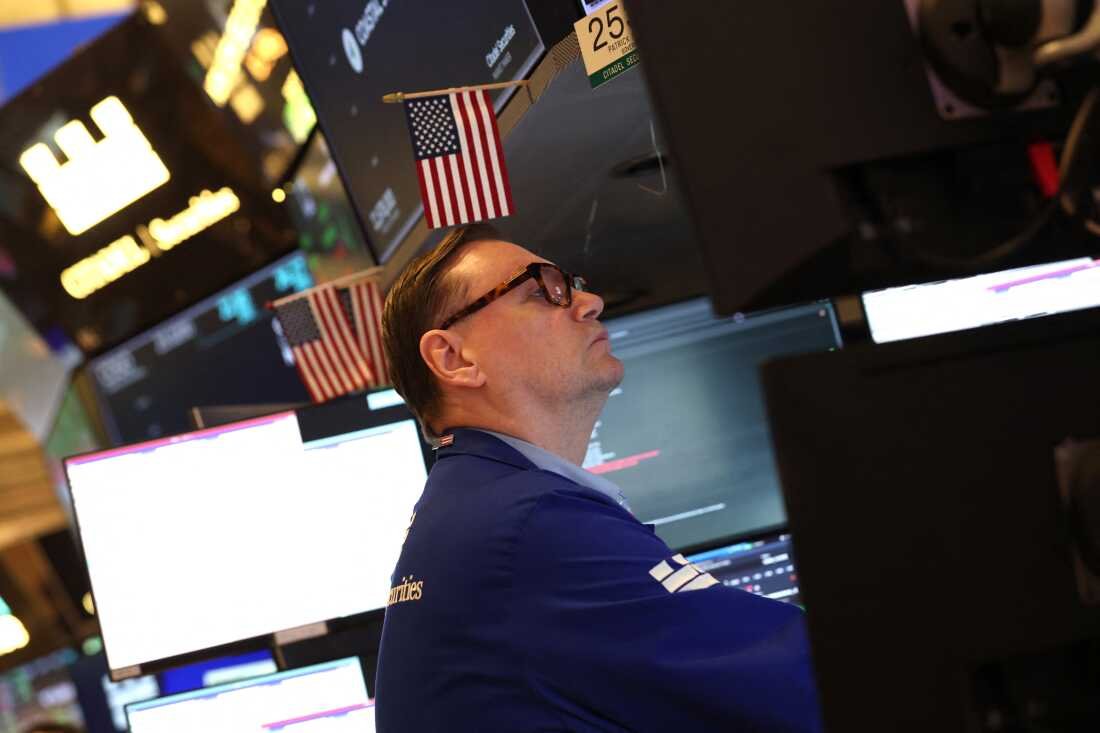 A trader works on the floor of the New York Stock Exchange (NYSE) after the opening bell in New York on January 7, 2026. The Dow Jones Industrial Average hit record highs on Monday and Tuesday, lifted in part by some Venezuela-related stocks.
