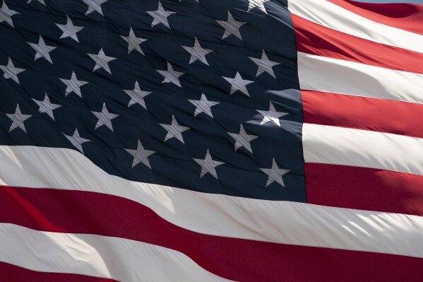 FILE - The American flag flies in Lycoming County, Pennsylvania, June 30, 2019. (AP Photo/J. Scott Applewhite)