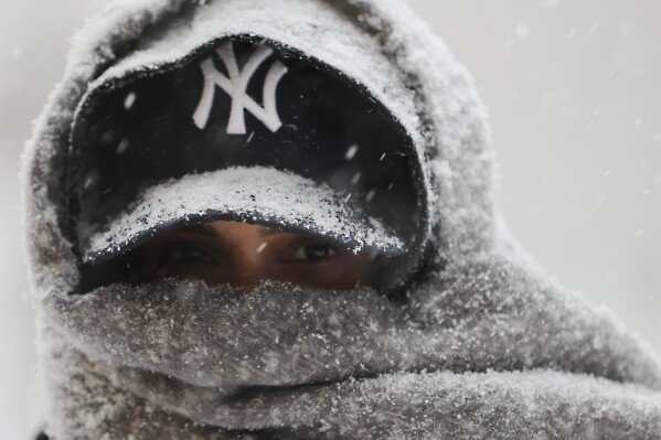 Abrar Omar walks through Manhattan during a winter storm, Sunday, Jan. 25, 2026, in New York. (AP Photo/Heather Khalifa)