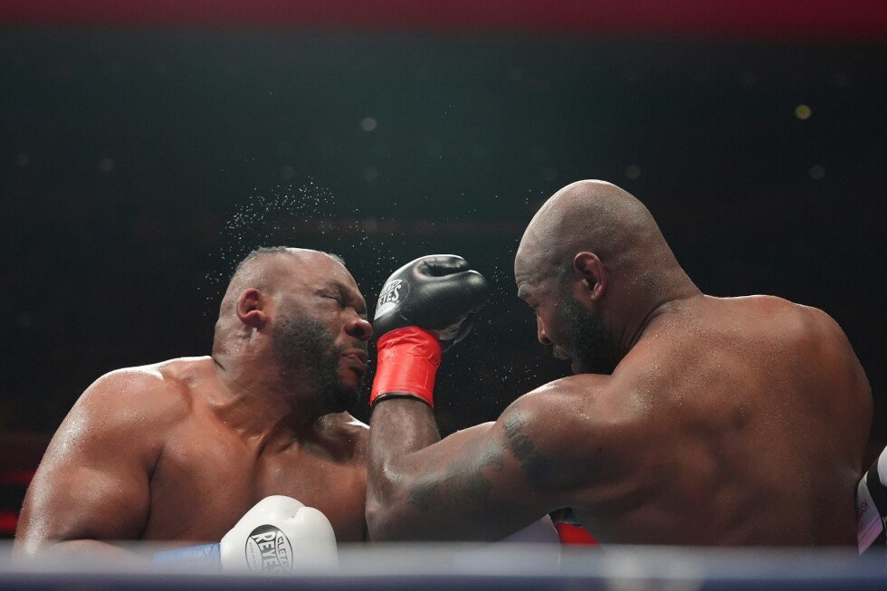 boxer-jarrell-miller-has-his-hairpiece-knocked-upward-by-a-punch,-then-throws-it-into-the-crowd