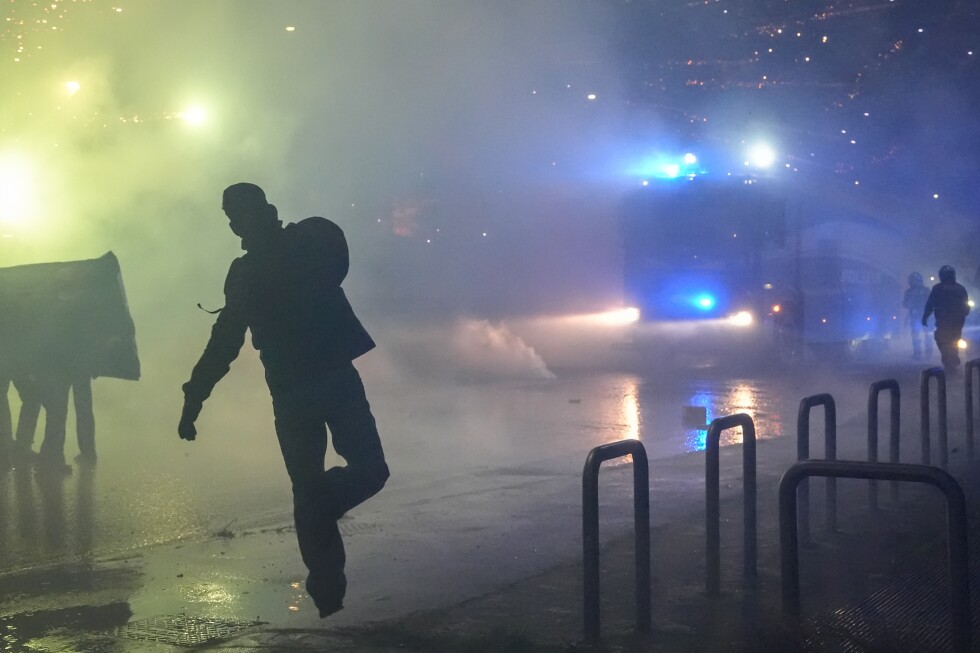 italian-police-fire-tear-gas-as-protesters-clash-near-winter-olympics-hockey-venue