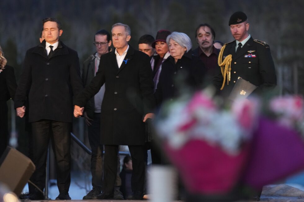 prime-minister-carney-and-canada’s-main-opposition-leader-hold-hands-during-school-shooting-vigil