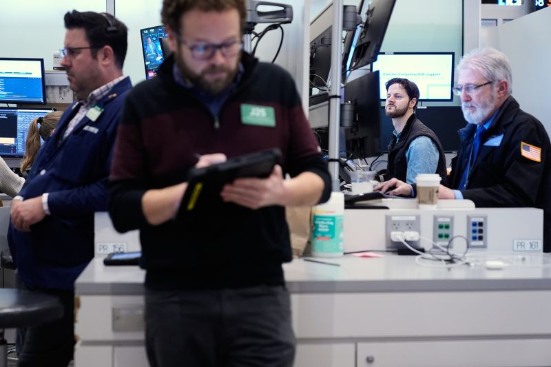 Traders work on the floor at the New York Stock Exchange on January 9, 2026.
