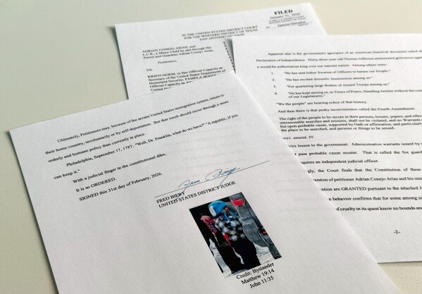 An order to release 5-year-old Liam Conejo Ramos and his father from detention, which included a picture of the boy and Bible verse references under the signature of U.S. District Judge Fred Biery, is photographed Saturday, Jan. 31, 2026. (AP Photo/Sydney Schaefer)