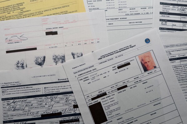 A document that was included in the U.S. Department of Justice release of the Jeffrey Epstein files is photographed Sunday, Feb. 1, 2026, shows the report when Epstein was taken into custody on July 6, 2019. (AP Photo/Jon Elswick)