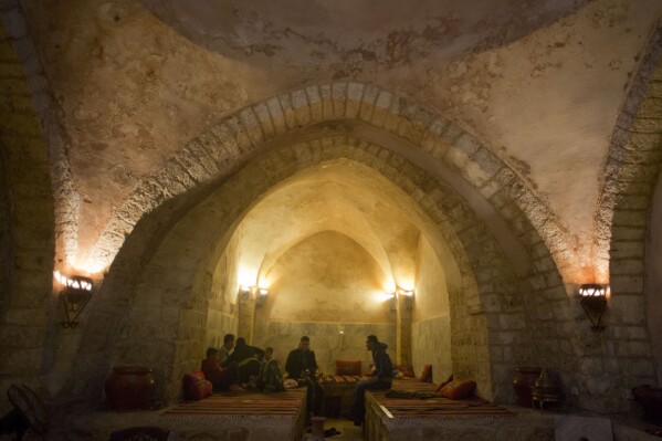 Palestinians rest at the reception of Hamam al-Sumara a historic bathhouse in Gaza City, Saturday, May 2, 2015. Hamam al-Sumara means 