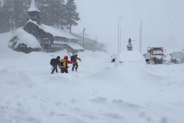 This image provided by the Nevada County Sheriff's Office shows members of a rescue team in Soda Springs, California on Tuesday, Feb. 17, 2026. (Nevada County Sheriff's Office via AP)