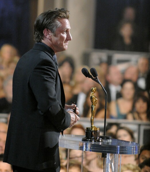 FILE - Sean Penn accepts the Oscar for best actor for his work in 