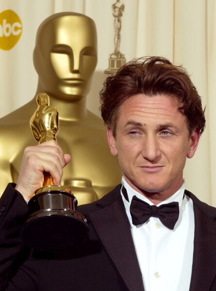 FILE - Sean Penn holds the Oscar he won for best actor for his work in 