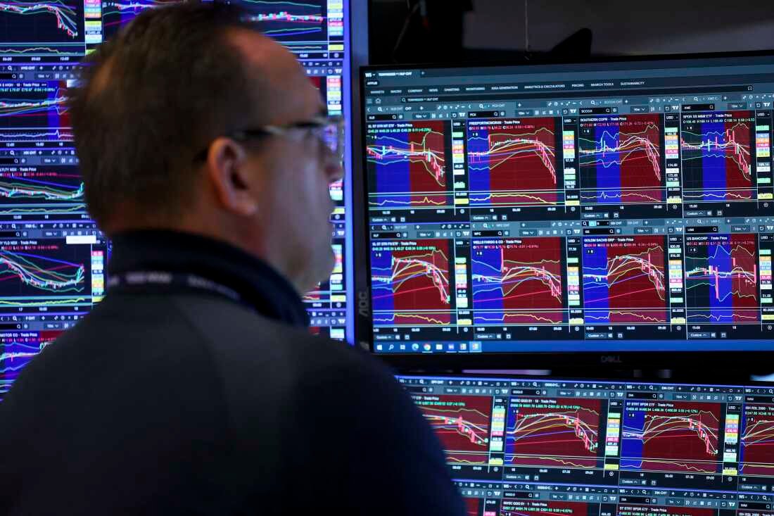 A trader works on the floor of the New York Stock Exchange (NYSE) at the opening bell in New York on March 18, 2026.