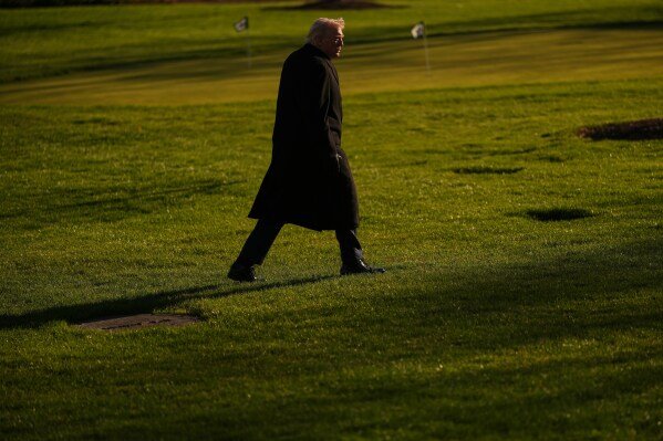 President Donald Trump walks on the South Lawn after arriving on Marine One at the White House, Monday, March 23, 2026, in Washington. (AP Photo/Julia Demaree Nikhinson)