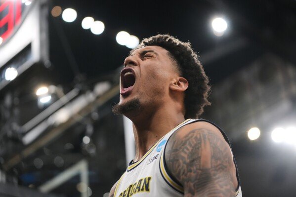 Michigan's Yaxel Lendeborg (23) celebrates during the second half in the Elite Eight of the NCAA college basketball tournament against Tennessee, Sunday, March 29, 2026, in Chicago. (AP Photo/Erin Hooley)