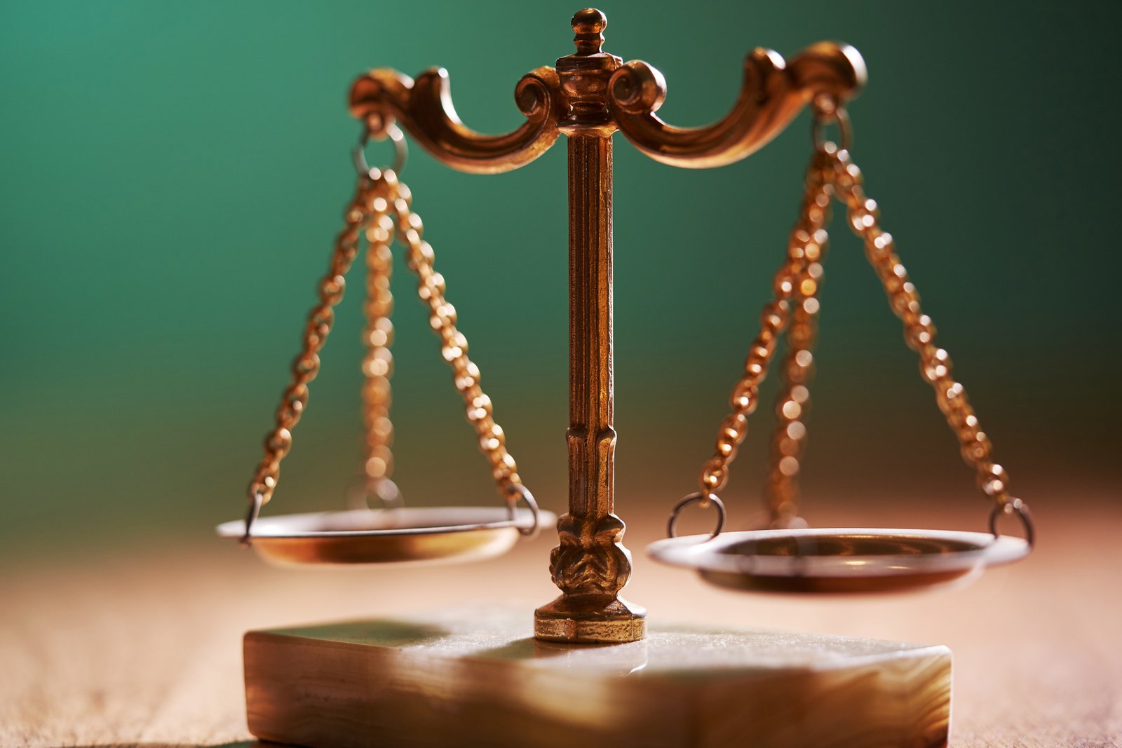 closeup of a gold libra scale