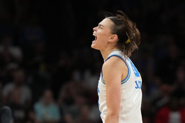 UCLA guard Gabriela Jaquez (11) celebrates after a play against South Carolina during the second half of the women's National Championship Final Four NCAA college basketball tournament game, Sunday, April 5, 2026, in Phoenix. (AP Photo/Rick Scuteri)