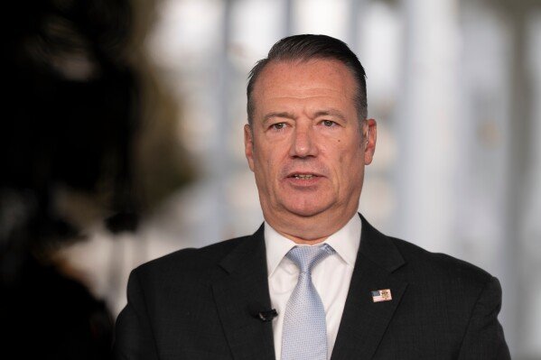 Todd Lyons, acting director of the U.S. Immigration and Customs. Enforcement (ICE), speaks during a television interview the White House Nov. 3, 2025 in Washington. (AP Photo/Manuel Balce Ceneta, File)