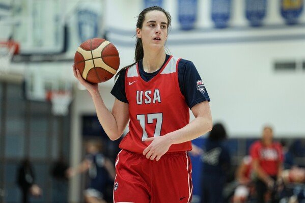 Caitlin Clark (17) takes part in drills during a training camp for the U.S women's national basketball team Dec. 12, 2025, in Durham, N.C. (AP Photo/Matt Kelley, File)