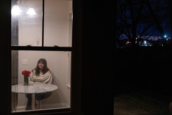 Kate poses for a portrait in her apartment in Bowling Green, Ky., Wednesday, December 10, 2025. (AP Photo/Michael Swensen)