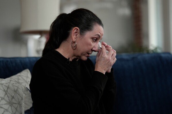 Leslie Albers wipes tears as she recounts her daughter’s struggle with mental health issues Saturday, Jan. 17, 2026, in Piperton, Tenn. (AP Photo/George Walker IV)