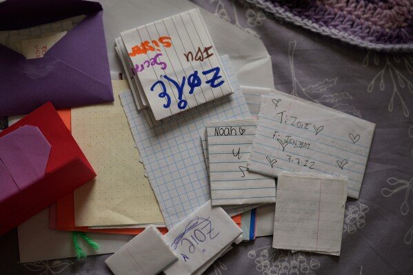 A pile of notes addressed to Zoie Albers is seen Saturday, Jan. 17, 2026, in Piperton, Tenn. (AP Photo/George Walker IV)