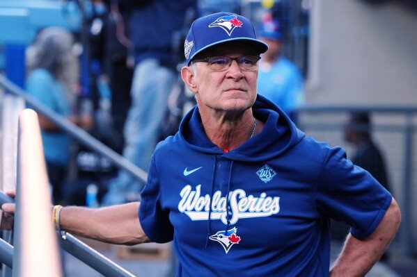 Toronto Blue Jays bench coach Don Mattingly surveys the crowd ahead of the first inning in Game 4 of baseball's World Series against the Los Angeles Dodgers in Los Angeles, Oct. 28, 2025. (Frank Gunn/The Canadian Press via AP, File)