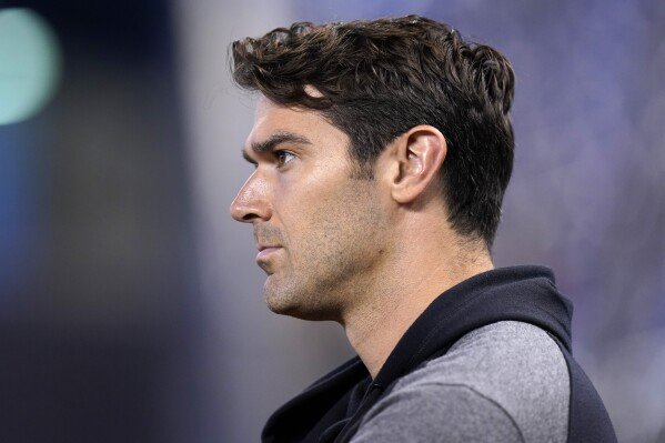 Preston Mattingly, manager of scouting for the San Diego Padres, stands on the field before a baseball game against the Miami Marlins, July 24, 2021, in Miami. (AP Photo/Lynne Sladky, File)