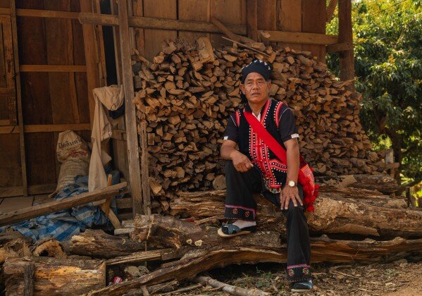 Sela Lipo, a Lahu elder, pauses after stacking firewood near his home in Tha Ton, Thailand, Friday, Feb. 20, 2026. (AP Photo/Anton L. Delgado)