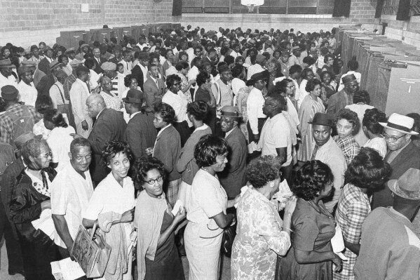 An estimated 1,000 African Americans wait in line to vote in the Democratic primary, the first major southern election since the 1965 Federal Voting Rights Act, in Birmingham, Alabama on May 3, 1966. (AP Photo)