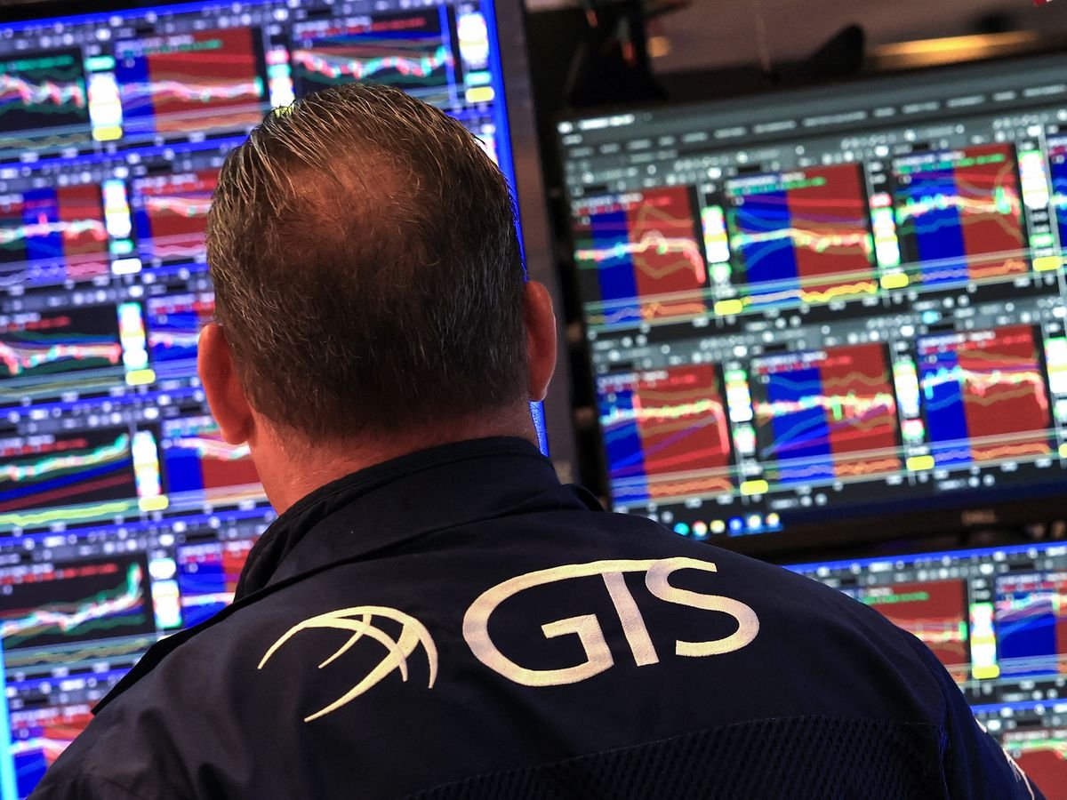 A trader works at his desk on the floor of the New York Stock Exchange (NYSE) in New York on May 19, 2026.