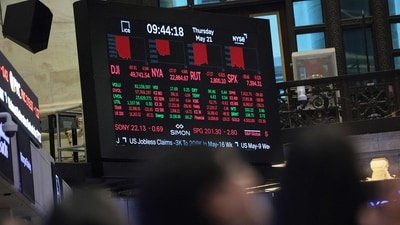 Stock market numbers are displayed on the floor of the New York Stock Exchange during morning trading (Getty Images via AFP)
