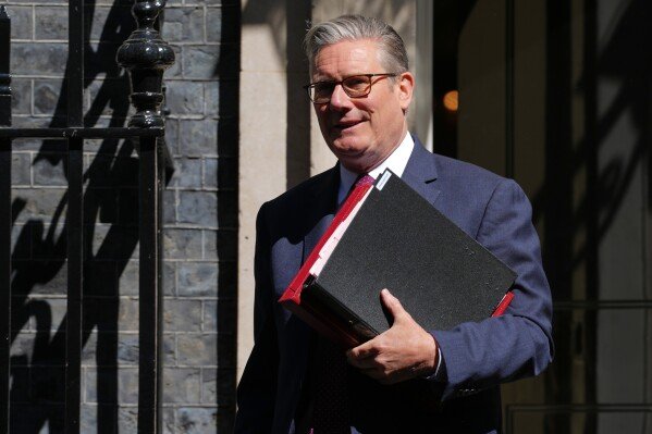 Britain's Prime Minister Keir Starmer leaves 10 Downing Street to attend the weekly session of Prime Minister's Questions in parliament in London, Wednesday, April 29, 2026. (AP Photo/Kirsty Wigglesworth)