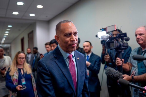 House Minority Leader Hakeem Jeffries, D-N.Y., speaks to reporters as he arrives for a Democratic Caucus meeting at the Capitol in Washington, Thursday, May 14, 2026. (AP Photo/J. Scott Applewhite)