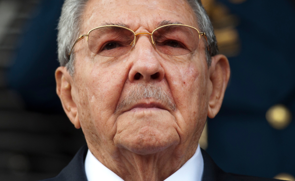 Cuba's President Raul Castro listens to the Cuban and Venezuelan national anthems during his welcome ceremony at the Miraflores presidential palace, March 17, 2015, in Caracas, Venezuela. (AP Photo/Ariana Cubillos, File)