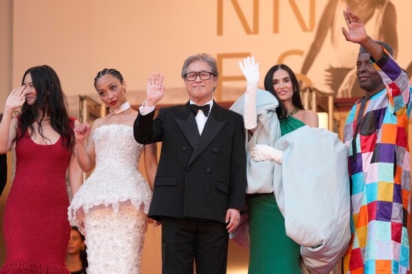Jury president Park Chan-wook, third from left, poses with jury members Chloe Zhao, from left, Ruth Negga, Demi Moore and Isaach de Bankolé upon arrival at the awards ceremony during the 79th international film festival, Cannes, southern France, Saturday, May 23, 2026. (AP Photo/John Locher)