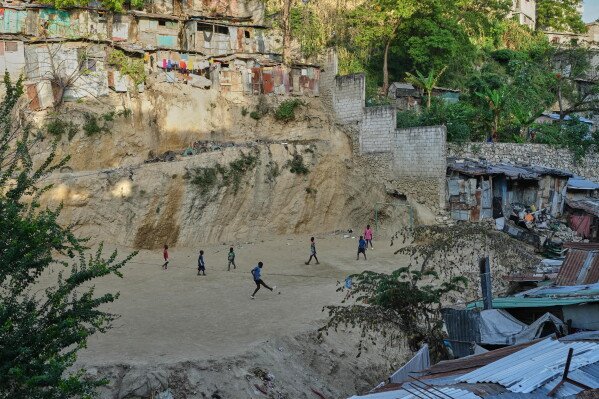Children play soccer with a plastic ball in the Pétion-Ville neighborhood of Port-au-Prince, Haiti, Wednesday, May 27, 2026. (AP Photo/Odelyn Joseph)