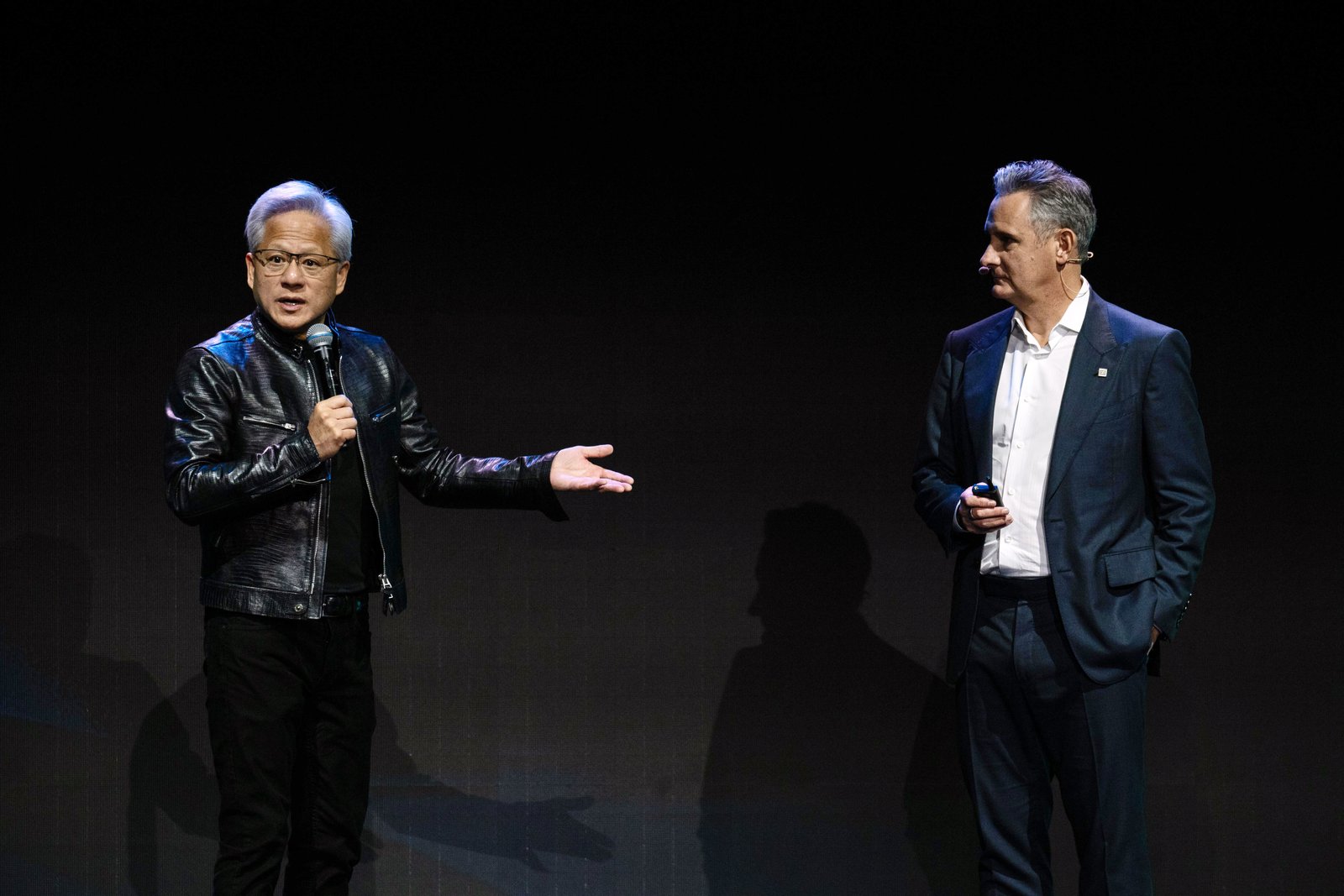 Jensen Huang, chief executive officer of Nvidia Corp., left, and Matt Murphy, chief executive officer of Marvell Technology Inc., on stage during Computex 2026 in Taipei, Taiwan, on Tuesday, June 2, 2026. 