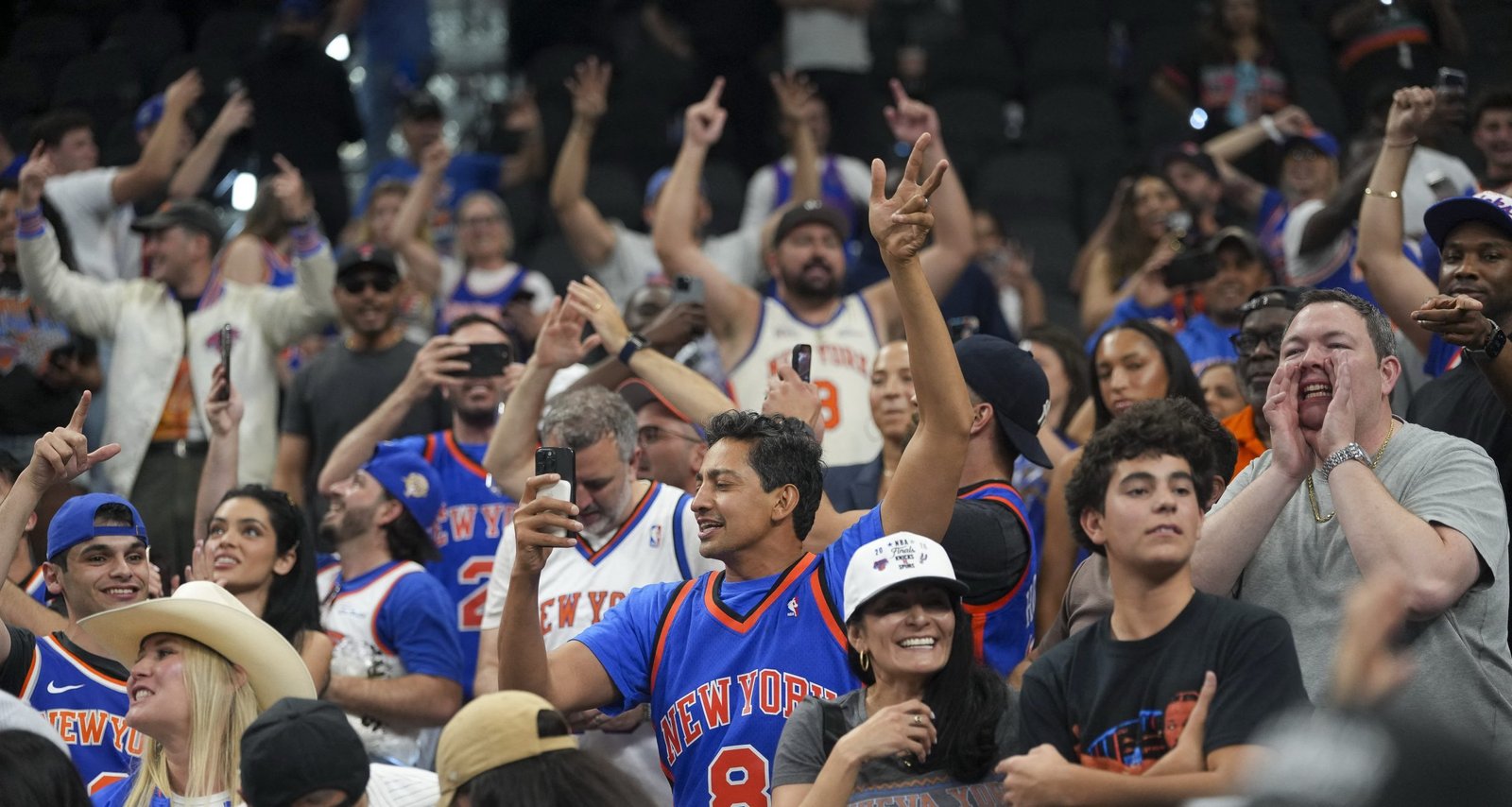 The New York Knicks fans celebrate after the Knicks defeat the San Antonio Spurs in game two of the 2026 NBA Finals at Frost Bank Center.