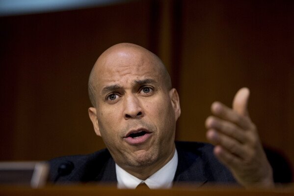 Sen. Cory Booker, D-N.J., questions Attorney General nominee William Barr as he testifies before a Senate Judiciary Committee hearing on Capitol Hill in Washington, Tuesday, Jan. 15, 2019. (AP Photo/Andrew Harnik)