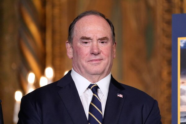 Secretary of the Navy John Phelan listens as President Donald Trump speaks at his Mar-a-Lago club, Dec. 22, 2025, in Palm Beach, Fla. (AP Photo/Alex Brandon, File)