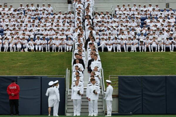 Naval Academy students enter Navy Marine Corps Stadium during the U.S. Naval Academy's graduation and commissioning ceremony at the U.S. Naval Academy, May 22, 2026, in Annapolis, Md. (AP Photo/Terrance Williams, File)
