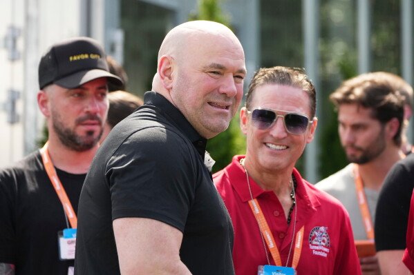 UFC President and CEO Dana White looks on before a motorsports athlete and stunt performer does a motorcycle jump ahead of the UFC Freedom 250 fights on the South Lawn of the White House, Saturday, June 13, 2026, in Washington. (AP Photo/Alex Brandon, Pool)