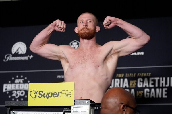 Middleweight fighter Bo Nickal poses during the official UFC Freedom 250 weigh-ins, Saturday, June 13, 2026, in Washington, ahead of Sunday's fight on the South Lawn of the White House. (AP Photo/Manuel Balce Ceneta)