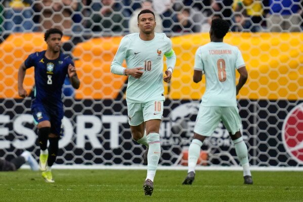 Kylian Mbappe of France runs during the international friendly soccer match between Brazil and France in Foxborough, Mass, Thursday, March 26, 2026. (AP Photo/Charles Krupa)