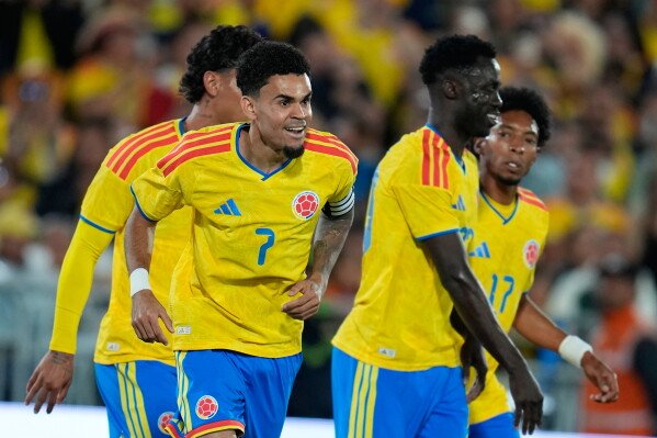 Colombia's Luis Diaz, left, celebrates scoring his side's second goal against Costa Rica during a friendly soccer match in Bogota, Colombia, Monday, June 1, 2026. (AP Photo/Fernando Vergara)