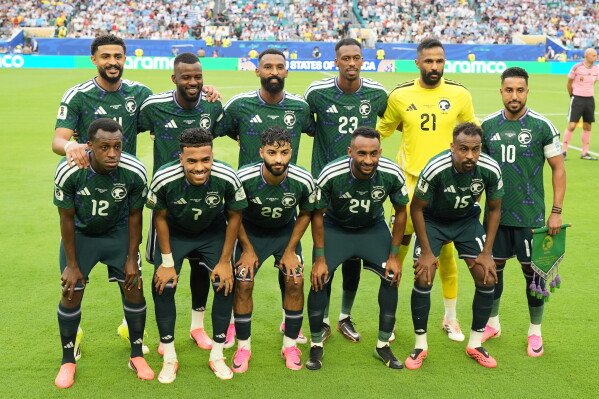 Saudi Arabia team pose for a group photo prior to the World Cup Group H soccer match between Saudi Arabia and Uruguay in Miami Gardens, Fla., Monday, June 15, 2026. (AP Photo/Rebecca Blackwell)