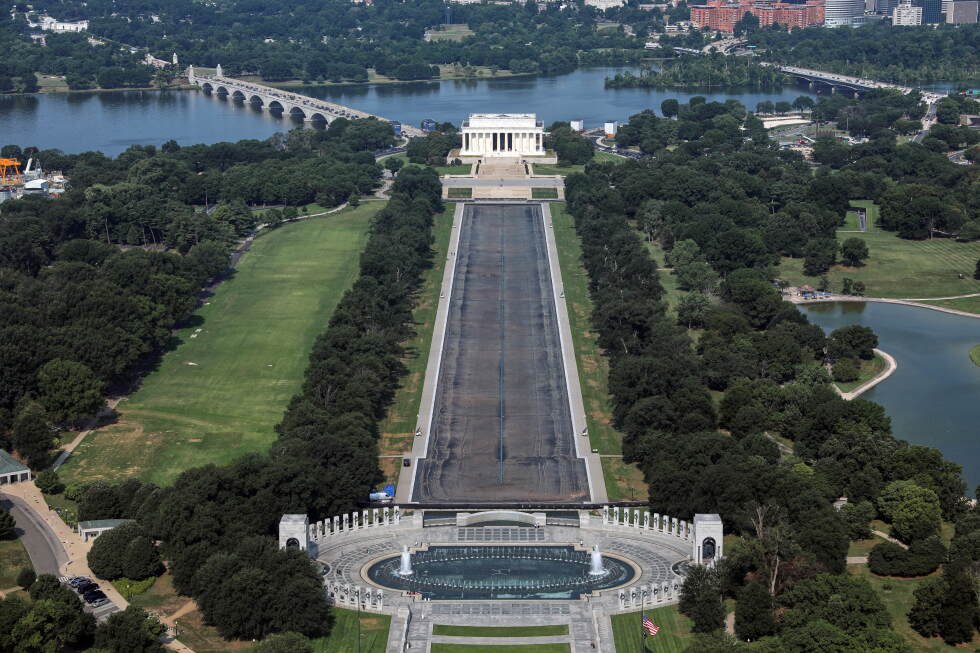 drained-reflecting-pool-reveals-faded-liner-after-renovation