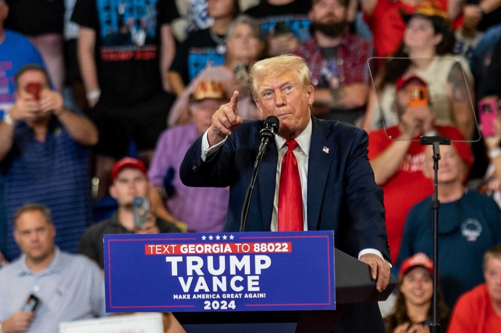An image of Donald Trump at a Trump-Vance podium with a crowd in the background_ Image by Phil Mistry via Shutterstock_