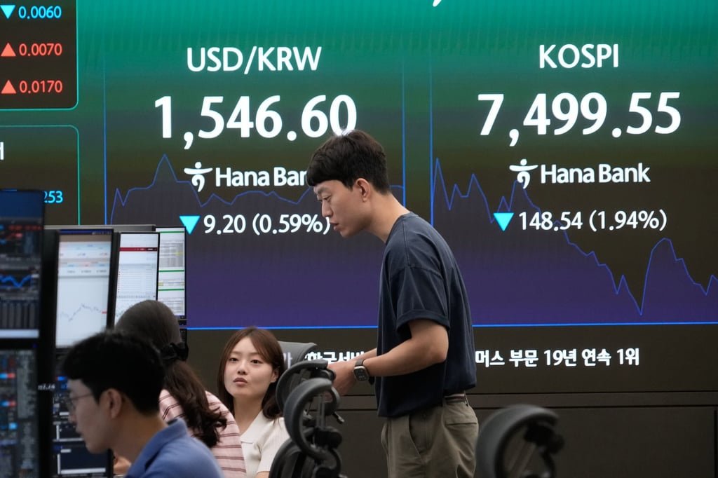 Currency traders at the Korea Composite Stock Price Index (KOSPI) in Seoul on July 3. Photo: AP