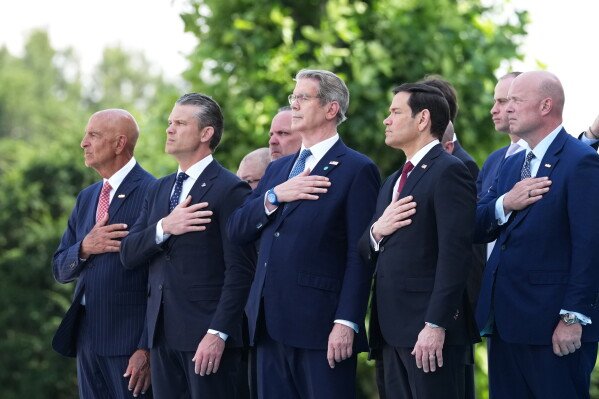 Front row from left, U.S. Ambassador to Turkey Tom Barrack, U.S. Defense Secretary Pete Hegseth, U.S. Treasury Secretary Scott Bessent, U.S. Secretary of State Marco Rubio and U.S. Ambassador to NATO Matthew G. Whitaker attend the formal welcome for President Donald Trump at the NATO summit at the Bestepe Presidential Palace in Ankara, Turkey, Tuesday, July 7, 2026. (AP Photo/Alex Brandon)